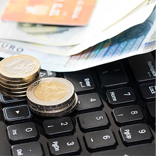 Money and bank card on the keyboard