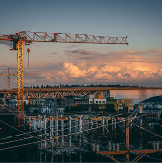A beautiful view of a construction site in a city during sunset