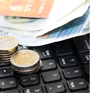 Money and bank card on the keyboard