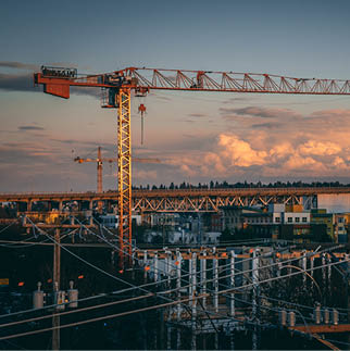A beautiful view of a construction site in a city during sunset