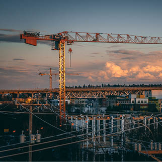 A beautiful view of a construction site in a city during sunset