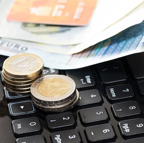 Money and bank card on the keyboard